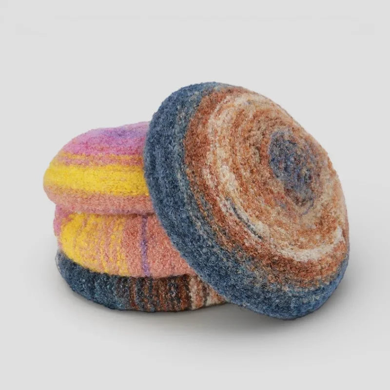 Circular hand-felted wool coasters with pastel swirls for Beret Pattern
