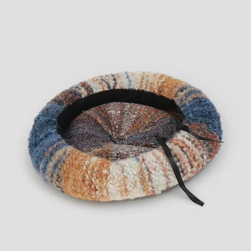 Cozy multicolored wool beret pattern in blue, beige, brown textured fabric