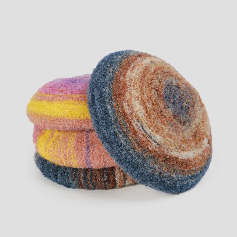 Stack of colorful, round, knitted coasters.