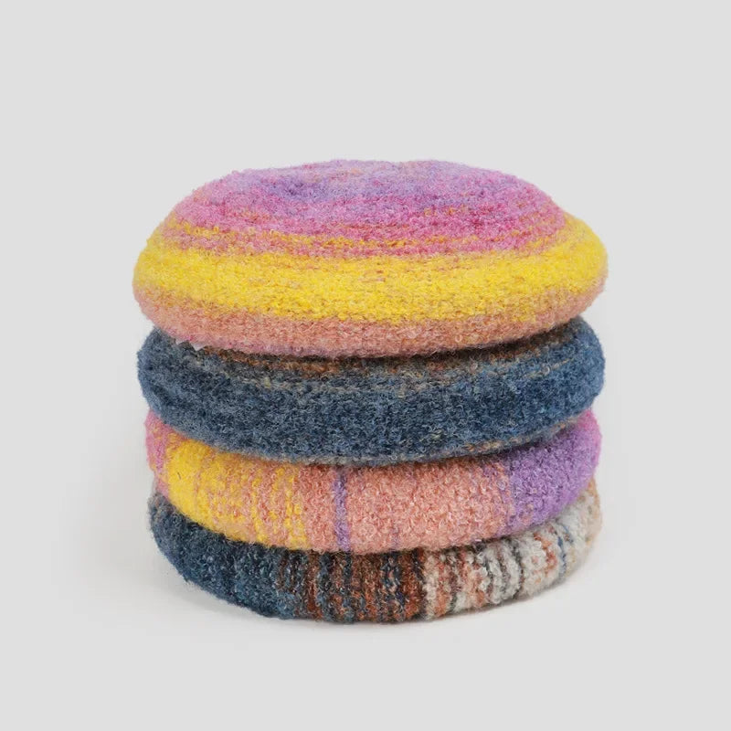 Stacked colorful wool berets.