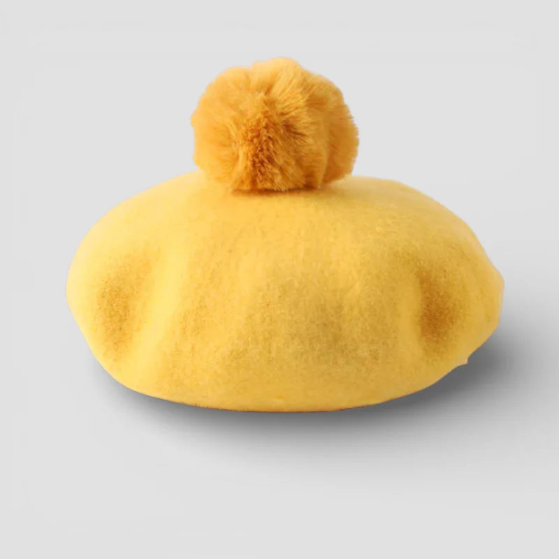 Yellow wool beret with matching felt pom-pom on top