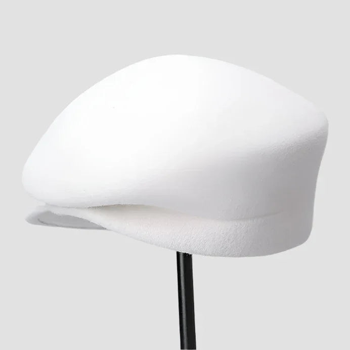 White flat cap on stand.