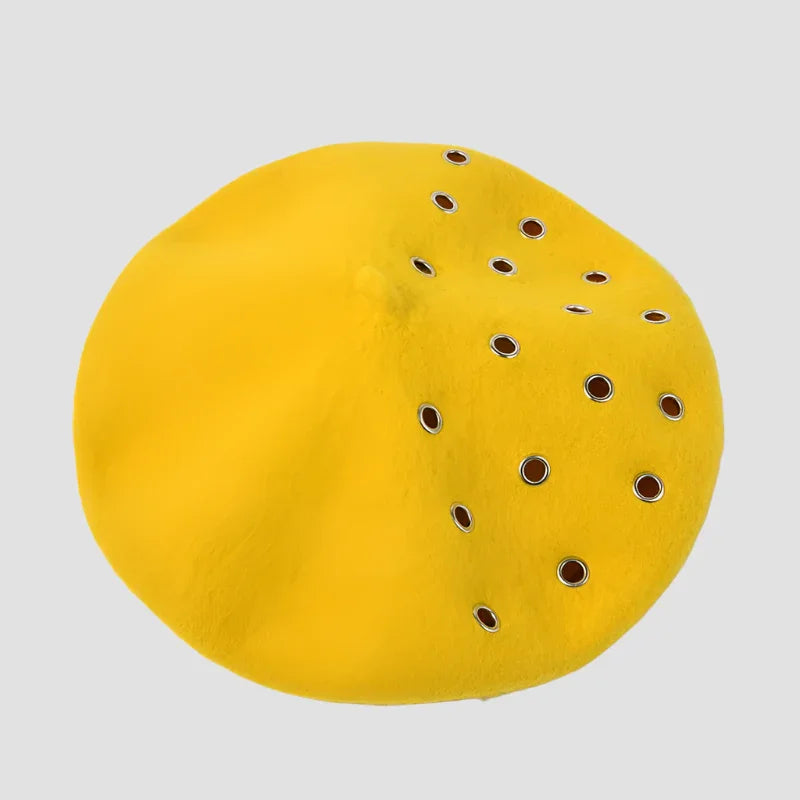 Yellow beret with grommets.