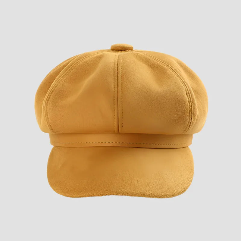 Mustard-colored newsboy cap.