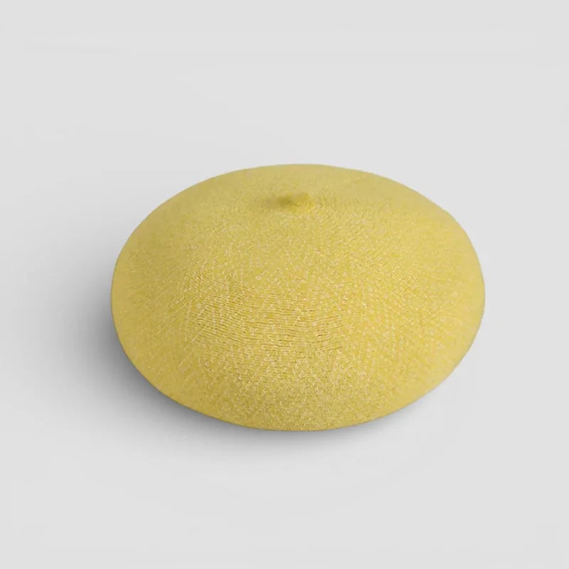 Yellow wool beret in soft pale yellow with textured fabric surface